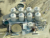 Microgy's Huckabay Ridge project in Texas aggregates manure, digesters and gas processing equipment at a central location, with eight 916,000-gallon digester tanks.