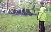 Police in the City of Toronto are called in to 'protect' the compost pile