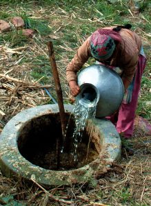 Water and bovine dung is put in the mixing chamber of biogas digester