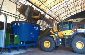 Processed wood waste and biosolids from the cities of Kelowna and Vernon, British Columbia, are loaded into a Supreme Enviro-Processor 900 batch mixer for composting.