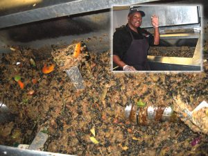 Raw food waste is loaded into the machine; large aluminum paddles (below) spin continuously, breaking up food waste particles. A mixture of microorganism and enzymes is added weekly; small plastic chips (shown at left) act as bulking agent.