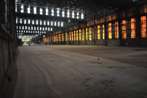 Chesapeake Compost Works opened October 1, 2012 in a 54,000-square-foot building in the industrial section of Baltimore City. The building housing the composting facility is more than 100 years old and has had many past uses, including airplane and train manufacturing.