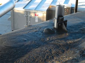 Foam is a frothy digesting sludge in which gas hold-up occurs, causing volume expansion. A rapid rise in foam formation can result in ejection of foam from the digester (above).