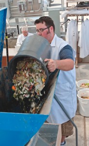 Food waste is emptied into a hopper that feeds a shredder, reducing the volume by about 30 percent.