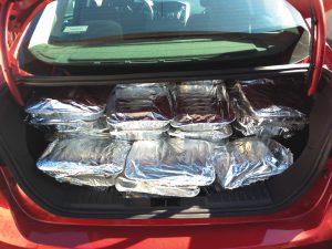 Prepared food is delivered in aluminum trays to the shelters and food pantries. Chapters use different methods to keep the food hot or cold while it is being collected and distributed.