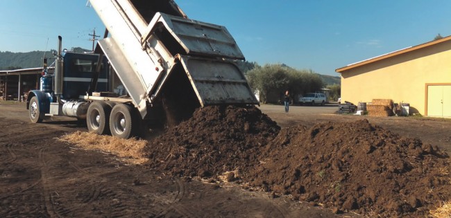 Composting at Preston Vineyards takes place in a roughly 60-by-200 foot area behind some farm buildings. Feedstocks include wood chips, mown grass, grape and olive pomace and organic dairy manure. Composting at Preston Vineyards takes place in a roughly 60-by-200 foot area behind some farm buildings. Feedstocks include wood chips, mown grass, grape and olive pomace and organic dairy manure.