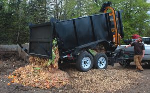 A 10-cy trailer with a cart lifter is used to collect commercial and institutional organics in the Northeast Kingdom. It can hold about 5 tons of food waste, and is pulled by a one-ton heavy-duty pick-up truck.