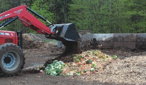 After unloading at Kingdom View Compost, food waste is mixed with wood chips, cow manure and silage and gradually rolled into a 3-sided cement receiving bay. Material remains there for 3 weeks to jumpstart the composting process. After unloading at Kingdom View Compost, food waste is mixed with wood chips, cow manure and silage and gradually rolled into a 3-sided cement receiving bay. Material remains there for 3 weeks to jumpstart the composting process.