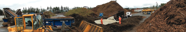 Panoramic view of North Mason Fiber’s fish composting process, including the grinding of wood and green waste, and making a receiving bed for the fish residuals.