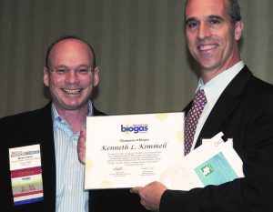 American Biogas Council (ABC) Board Chair, Wayne Davis (left), presents Kenneth Kimmell, Commissioner of the Massachusetts Department of Environmental Protection, the ABC Champion of Biogas Award at the BioCycle REFOR13 Conference.