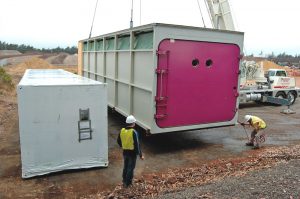 The SmartFerm containers, now manufactured in the U.S., were dropped into place using a crane.
