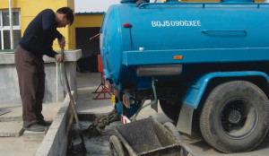 Chicken and pig manure are collected from participating farms in the Changping District (China) and brought to a central digester for processing. 