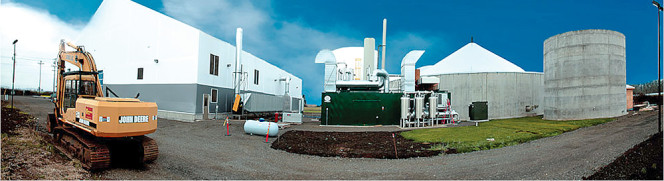 The facility includes a homogenization tank, a continuously stirred tank reactor where feedstocks digest for 30 days and a post digester with a gas holder on top.