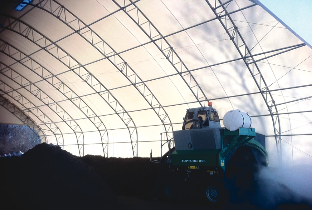 Operators at the UConn Agricultural Waste Composting Facility have ample space within the ClearSpan fabric structure to maneuver a 17-foot wide Komptech windrow turner.