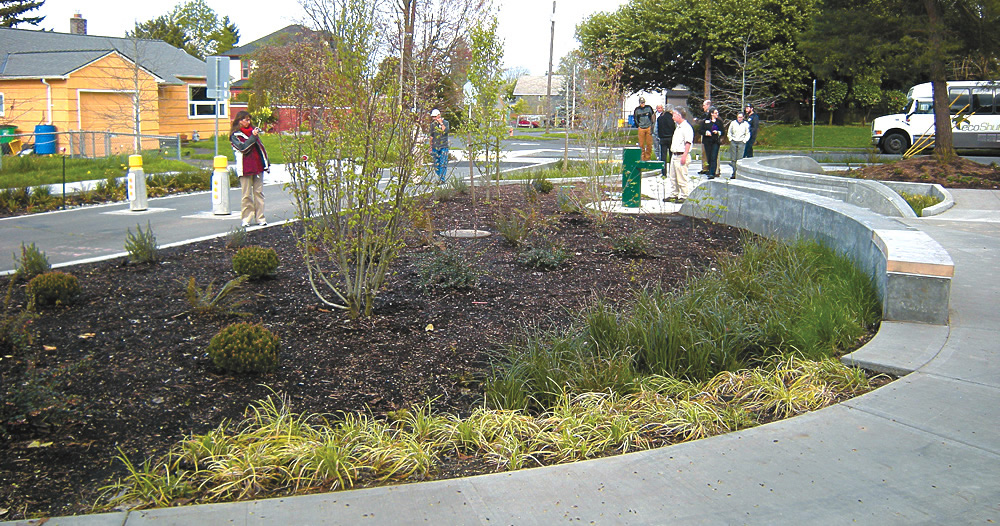 Green storm water infrastructure, such as this rain garden in Portland, Oregon, is becoming increasingly common to capture and infiltrate rainwater. Compost is often used in the engineered soil mixes for the rain gardens.
