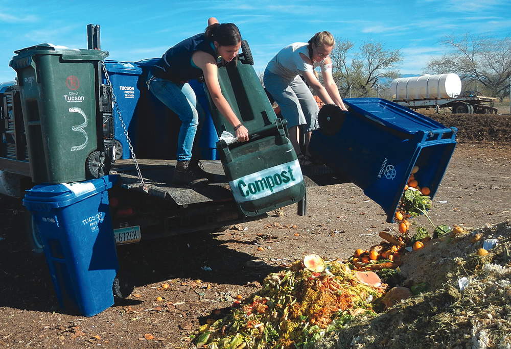 University of Arizona student members of Compost Cats work at the composting site located at the San Xavier Co-op Farm.