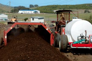 The Compost Unit annually processes about 4,000 tons of horse, cattle and poultry manure, and 3,500 cubic yards of landscape trimmings. An HCL turner is used to manage the windrows. 