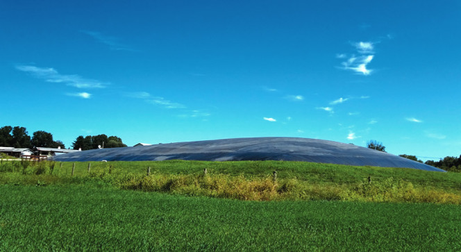 The covered lagoon digester has a capacity of 680,000 gallons. It treats dairy manure in addition to food wastes, such as chicken and meatball fat and ice cream waste.