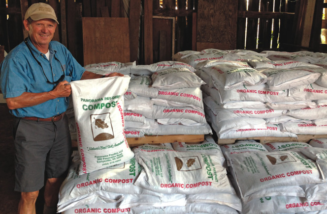 The Murrays built a bagging line that fills 6,000 one cubic yard bags of compost each year (Steve Murray shown holding a filled bag). 