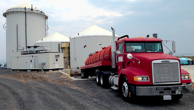 A tanker truck delivers grease trap waste from restaurants in the area to the digester facility at North State Rendering.