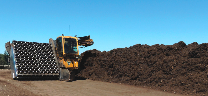 The mass bed is turned a minimum of every 7 days with a Vermeer elevating face compost turner.