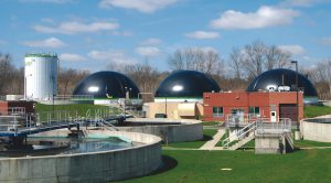 Retrofits to three anaerobic digesters (domed structures below) at the Wooster WWTP included adding a steel ring to each tank to increase volume by 100,000 gallons/tank, and to add mixers and heat exchangers. 