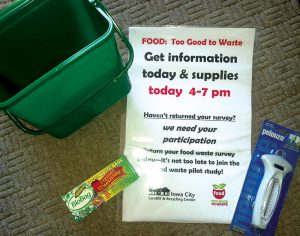 Iowa City, Iowa held an open house as part of its FTGTW Challenge to enable face-to-face contact with participants, who received a kitchen scale (lower right), countertop collection bin and compostable bags.