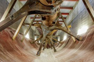 The horizontal plug flow digesters, about 115-feet in length, have a longitudinal paddle shaft that slowly rotates. Material traverses the digesters over a typical 21-day retention time. 