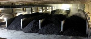 The solid digestate fraction first goes to a 7-day post-digestion composting phase, and then is moved to in-building aerated bunkers (above) for an additional 7 days of curing.