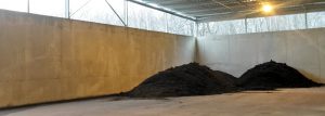 The storage area for finished compost is shown. About 30,000 tons/year of compost will be produced and marketed to farms in the region.