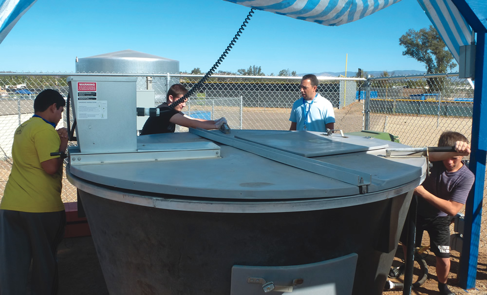 Composting of food scraps, green waste and tree trimmings is done on-site at Ramona High School in an Earth Tub unit. Student Eco-Leaders monitor the process, weighing and recording incoming feedstocks, taking temperatures and observing moisture levels.