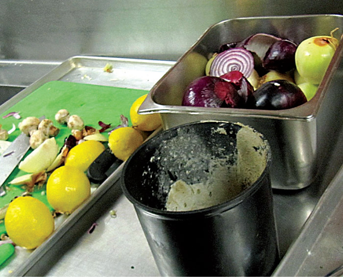 To make separation more convenient, foodservice employees can select bins that are most conducive to their particular stations. For example, a produce station uses a small round bucket atop the food bench.