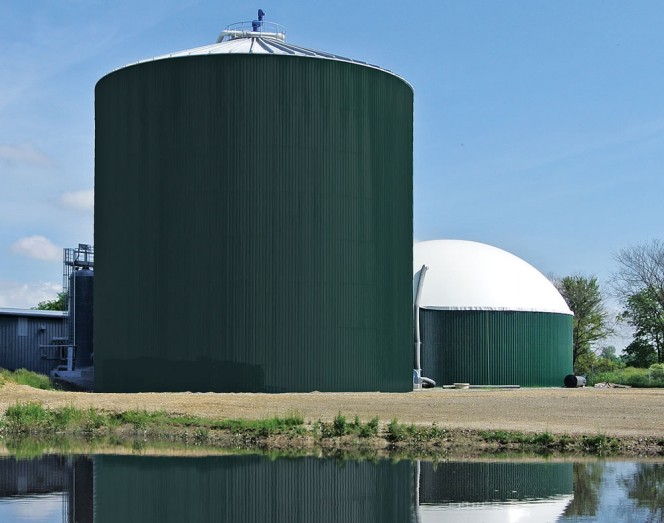 Napoleon Biogas, LLC processes organic waste from a neighboring Campbell Soup Company plant in Napoleon, Ohio. Underground pipes transport the organics from the plant to the digester (shown in foreground; biogas storage unit on right).