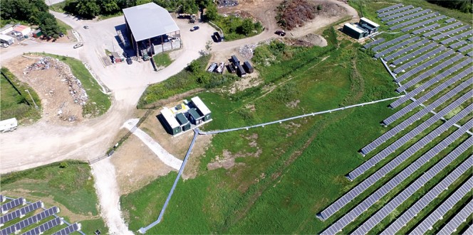 Green Mountain Power’s (GMP) new solar farm and battery storage facility is being dedicated in Rutland, Vermont. It is built on a closed landfill (battery storage units shown connected to solar array).