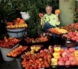 Craig Witt pioneered private composting in the state of Nevada (shown with heirloom tomatoes grown using Full Circle’s compost).