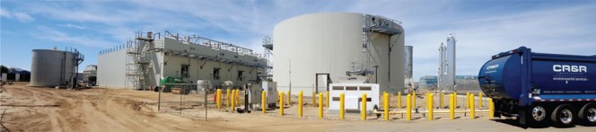 Phase 1 of CR&R’s new AD system has capacity to process 83,600 tons/year of yard trimmings and food waste. Four Eisenmann digesters are housed in the rectangular building; the fueling station is in the foreground.