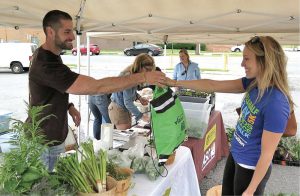 “Organic Allentown” creates opportunities for people who want to farm by assisting with access to underutilized urban land and establishing farmers markets (above) to sell the produce.