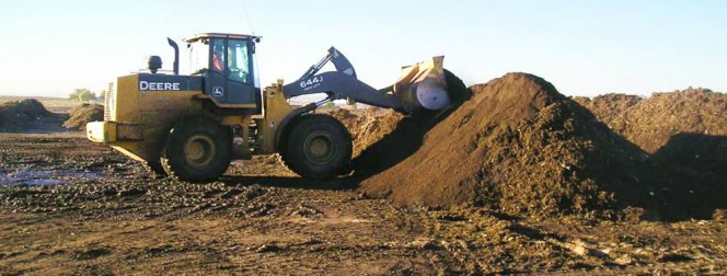 Once a pile or windrow is built, a 3- to 4-inch cap of compost placed over it will act as an in situ biofilter for fugitive emissions.