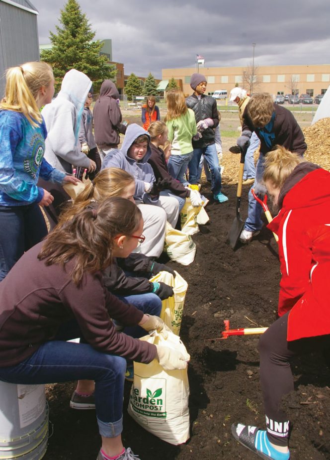 Compost is transported in bulk to the host site. The participating group and their volunteers bag the compost with tools and supplies from the MNCC.