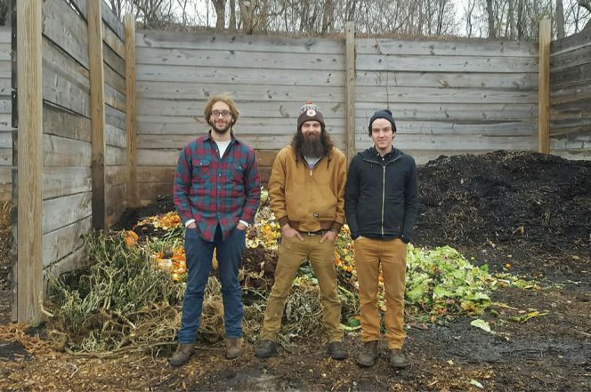 Rust Belt Riders (from left to right) Jesse Williams, Michael Robinson and Daniel Brown stand in front of one day’s worth of collected food scraps at the Rid-All Green Partnership farm. 