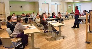 “Social determinants of health are housing, employment and hunger,” says Dr. Eric Handler, shown (at right) addressing a workshop in New Haven, Connecticut. “If these determinants aren’t addressed, we will not be able to address health of our population in a sustainable manner.”