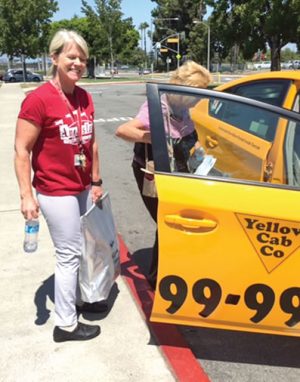 Food donated by Savanna High School in Anaheim (CA) is transported to a family resource center by a Yellow Cab.