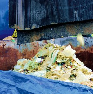 Depackaging commingled food scraps — density is code and force can act as switch to separate packaging.