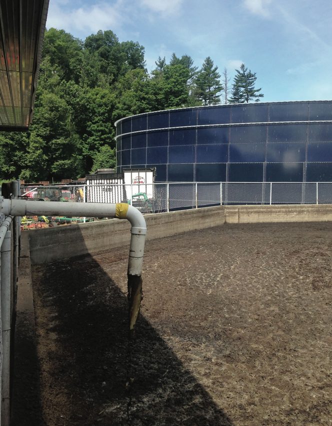 Pipe in foreground conveys water squeezed out of manure back to storage pit with less manure solids and associated phosphorous and other nutrients. Photo by Robert Spencer