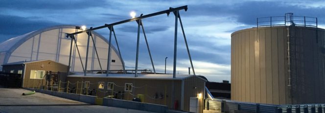 A1 Organics’ Digester Processing System, which includes DODA and Tiger depackagers, is housed in fabric structure near the digester’s feedstock storage tank (top).