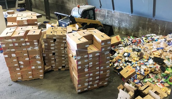 Storage area for packaged dry foods such as bread and cereal, to be loaded into the Scott Turbo Separator, and recovered for animal feed. An entire pallet of packaged food, inside a large cardboard box, can be tipped into the hopper for processing. 