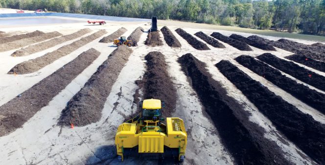 ECUA uses the Modified Static Aerobic Pile composting method, which incorporates a Harvest Quest inoculant. A Backhus compost turner mixes the blend of yard trimmings and biosolids (3:1 ratio, by volume) and forms a windrow (above). Inoculant is added, and the windrow is capped with a layer of screened overs or freshly ground yard trimmings.