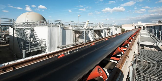 An automated smart conveyor delivers feedstock from the organics recovery facility to fill “hoppers” that feed the digesters.