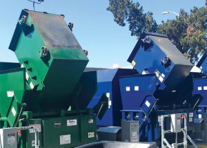 Once all contamination is removed, sorters put organics into green 40-cubic yard compactors.