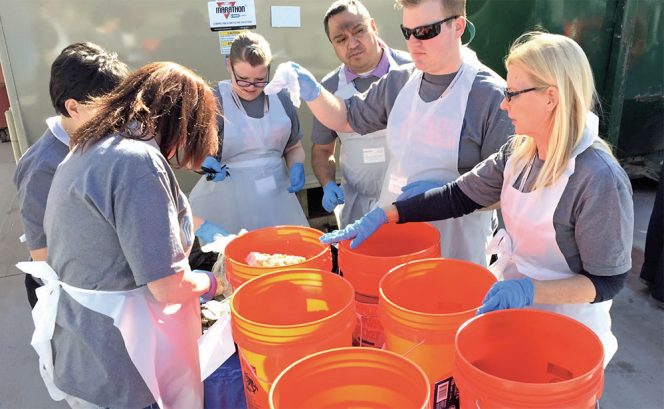 Zero Waste training at Arizona State University includes sorts of the trash, recycling and organics bins to identify and eliminate challenging materials. Sorting contents of front-of-house bins, directed by Stephanie Barger of GBCI’s Zero Waste program (on right in front), shown above.  